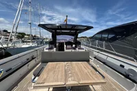 2015 Fjord 40 Open yacht with wooden deck and seating, docked in a marina.