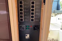 Control panel on a 2015 Fjord 40 Open yacht, featuring labeled switches and controls.