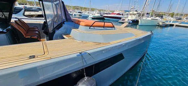  Yacht Photos Pics 2019 Sunreef 40 Open yacht docked in a marina, featuring sleek design and wooden deck.
