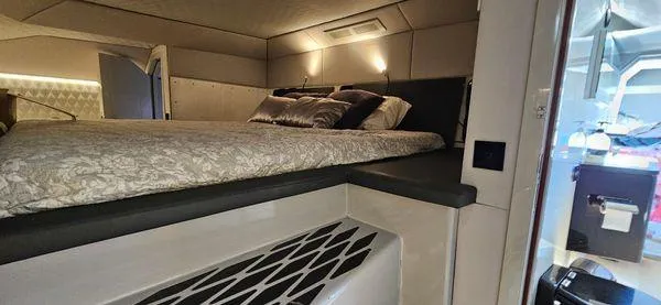  Yacht Photos Pics Luxurious cabin interior of 2019 Sunreef 40 Open yacht with elegant bedding and modern lighting.