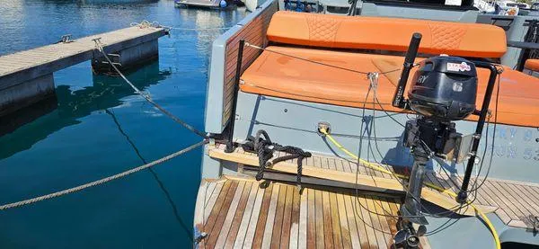  Yacht Photos Pics 2019 Sunreef 40 Open yacht docked, featuring orange seating and wooden deck.