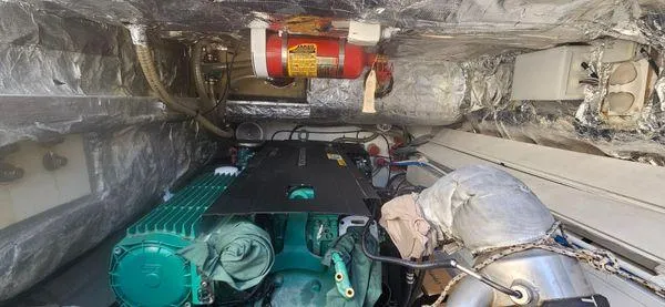 Yacht Photos Pics Engine room of 2019 Sunreef 40 Open yacht with visible machinery and fire extinguisher.