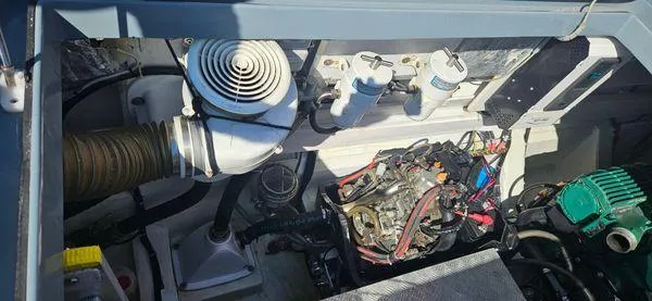  Yacht Photos Pics Engine compartment of a 2019 Sunreef 40 Open boat, showcasing mechanical components and wiring.