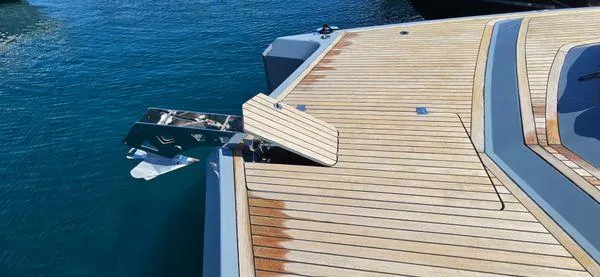  Yacht Photos Pics 2019 Sunreef 40 Open yacht with sleek wooden deck on blue water.