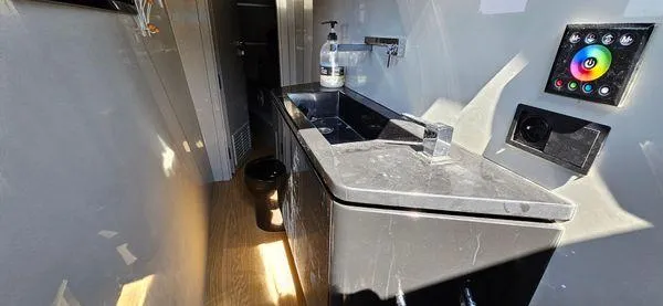  Yacht Photos Pics Luxurious bathroom interior of 2019 Sunreef 40 Open yacht with modern sink and control panel.