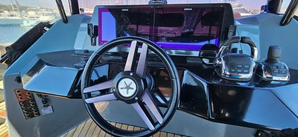  Yacht Photos Pics Steering console of 2019 Sunreef 40 Open yacht with modern controls and navigation display.