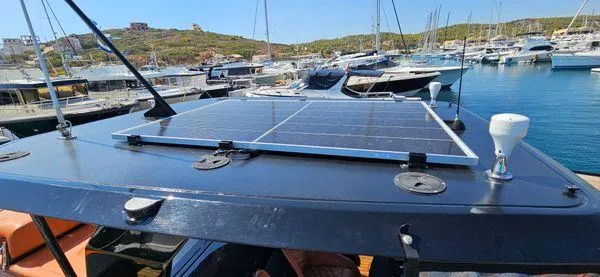  Yacht Photos Pics 2019 Sunreef 40 Open yacht with solar panels docked in a marina.