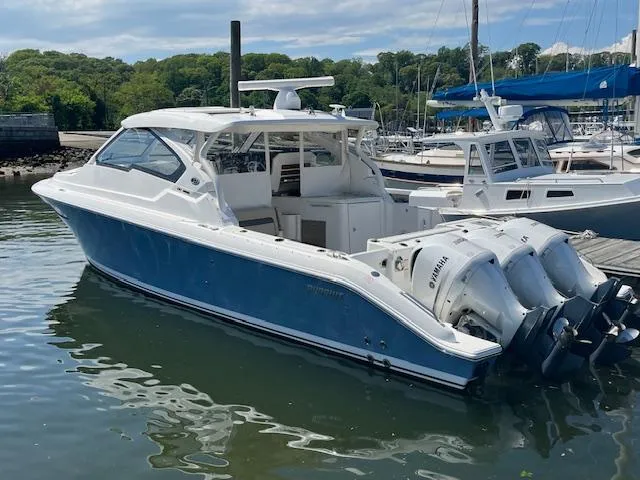  Yacht Photos Pics 2019 Pursuit DC 365 Dual Console boat docked with triple Yamaha outboard engines.