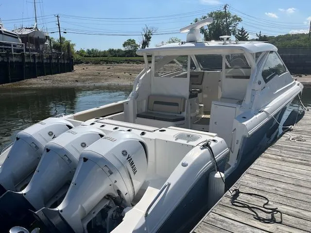  Yacht Photos Pics 2019 Pursuit DC 365 Dual Console boat docked with triple Yamaha engines.