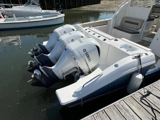  Yacht Photos Pics 2019 Pursuit DC 365 Dual Console boat with Yamaha outboard engines docked in marina.