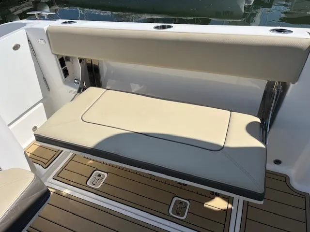  Yacht Photos Pics 2019 Pursuit DC 365 Dual Console boat with beige seating and teak flooring.