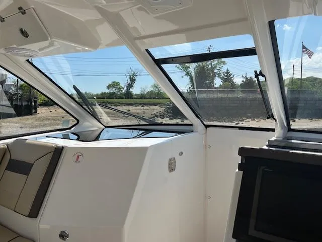  Yacht Photos Pics 2019 Pursuit DC 365 Dual Console interior with sleek design and large windows.
