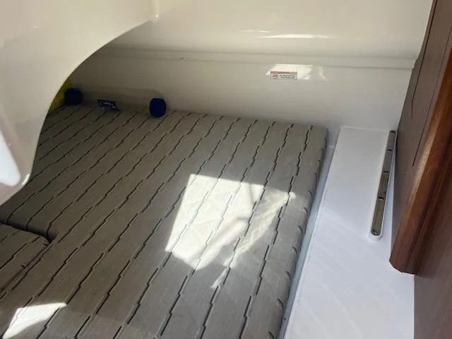  Yacht Photos Pics Interior cabin of 2019 Pursuit DC 365 Dual Console boat with cushioned seating.