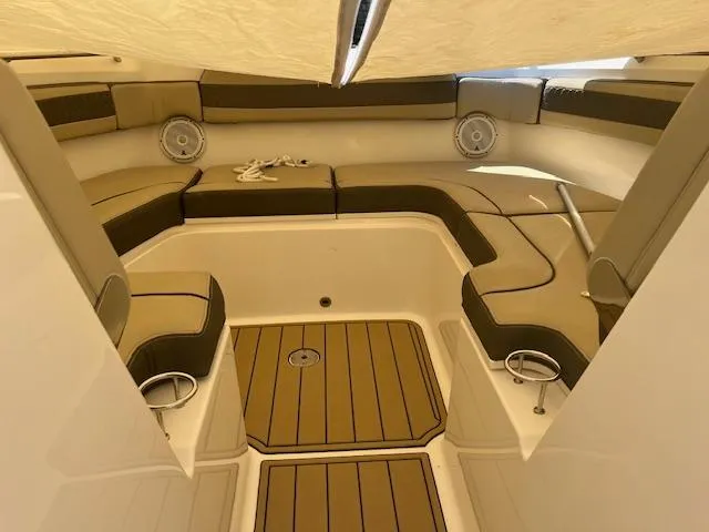  Yacht Photos Pics 2019 Pursuit DC 365 Dual Console boat interior with cushioned seating and teak flooring.