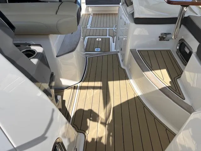  Yacht Photos Pics 2019 Pursuit DC 365 Dual Console interior with sleek seating and teak-style flooring.