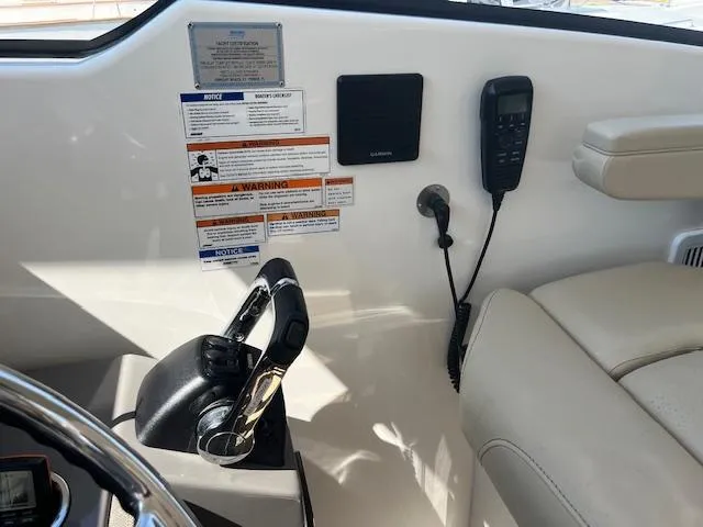  Yacht Photos Pics 2019 Pursuit DC 365 Dual Console cockpit with controls, warning labels, and communication equipment.