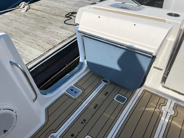  Yacht Photos Pics 2019 Pursuit DC 365 Dual Console boat deck with storage and teak flooring.