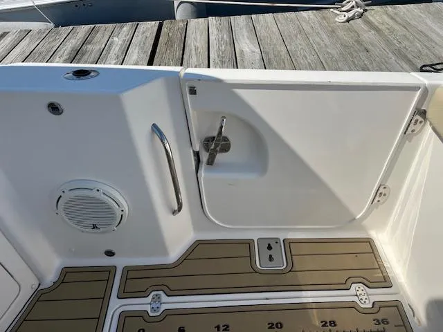  Yacht Photos Pics 2019 Pursuit DC 365 Dual Console boat deck with speaker and storage compartment.