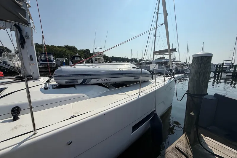 Tupelo Honey Yacht Photos Pics 2022 Dufour 530 yacht docked with inflatable boat on deck.