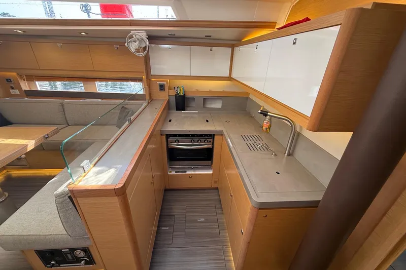 Tupelo Honey Yacht Photos Pics Modern kitchen interior of 2022 Dufour 530 yacht with sleek design and ample storage.