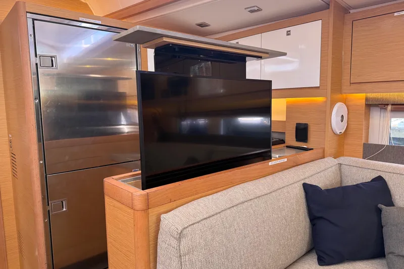 Tupelo Honey Yacht Photos Pics Modern interior of 2022 Dufour 530 yacht with pop-up TV and sleek design.