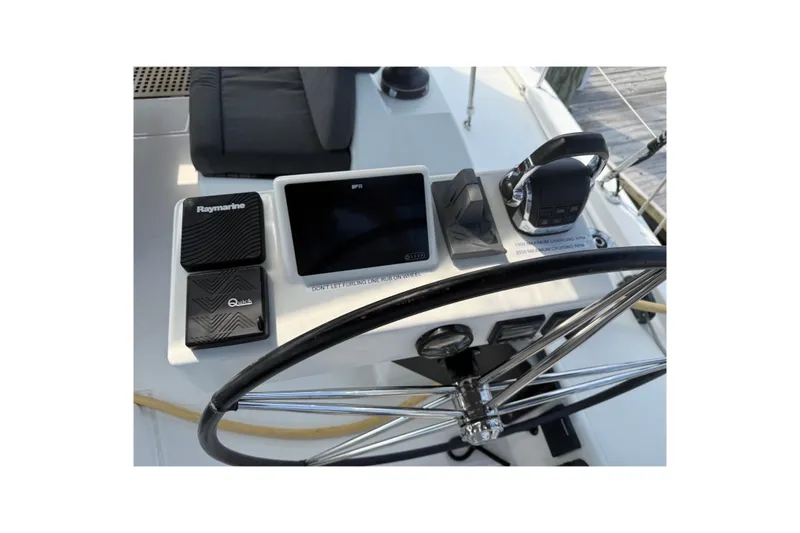 Tupelo Honey Yacht Photos Pics Steering console of 2022 Dufour 530 yacht with navigation equipment and controls.
