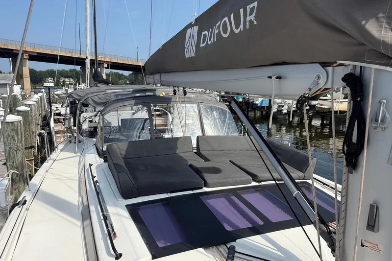 Tupelo Honey Yacht Photos Pics 2022 Dufour 530 sailboat docked, featuring spacious deck and modern design.