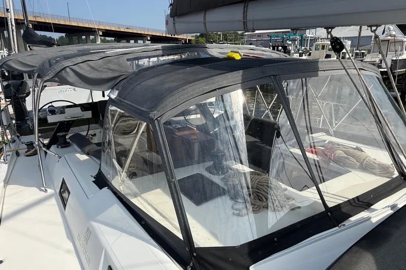 Tupelo Honey Yacht Photos Pics 2022 Dufour 530 sailboat with covered cockpit, docked at marina.