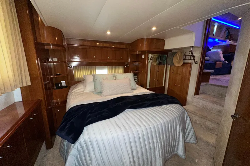 Stay The Course Yacht Photos Pics Luxurious bedroom interior of 2006 Carver 43 Motor Yacht with elegant wood finishes.