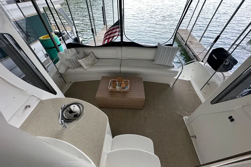 Stay The Course Yacht Photos Pics 2006 Carver 43 Motor Yacht interior with seating, table, and lake view.