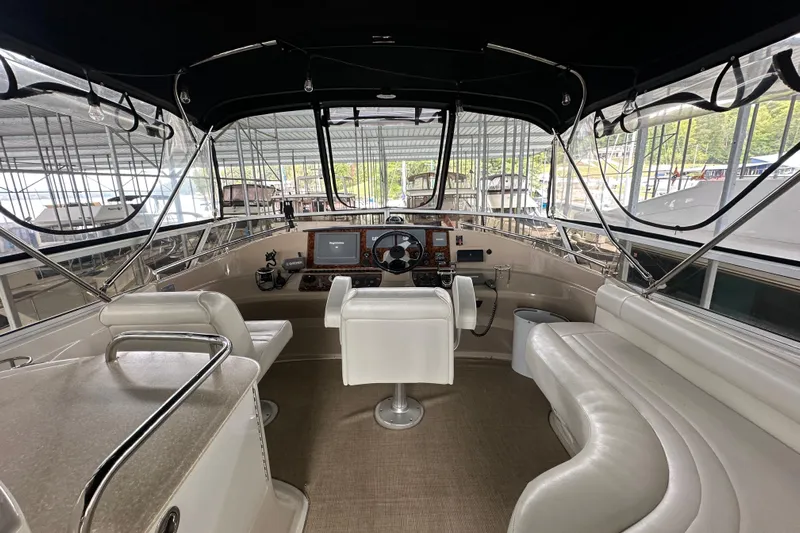 Stay The Course Yacht Photos Pics 2006 Carver 43 Motor Yacht interior with helm, seating, and navigation equipment.