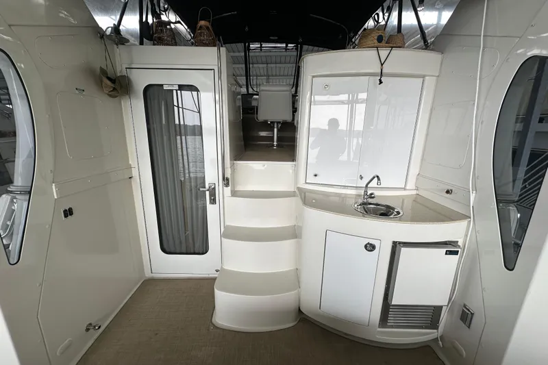 Stay The Course Yacht Photos Pics 2006 Carver 43 Motor Yacht interior with stairs, kitchenette, and door.