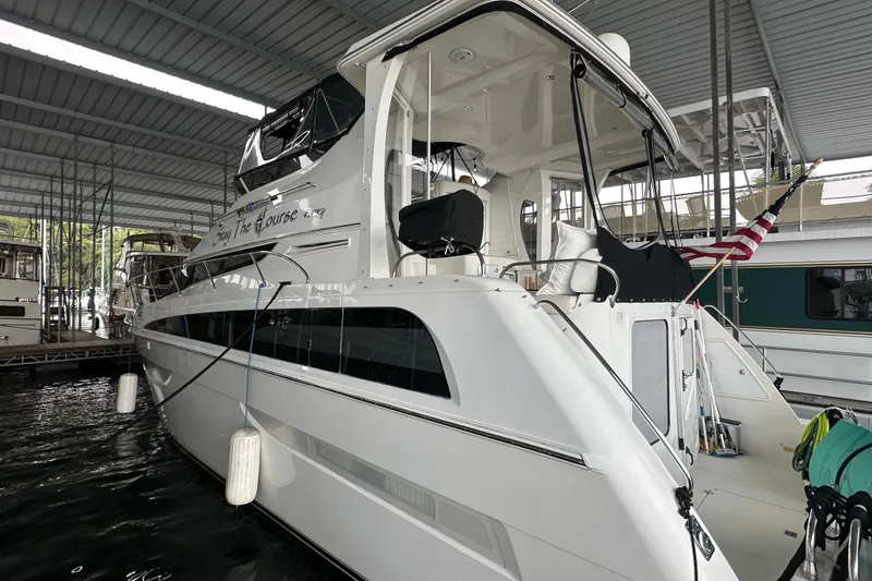 Stay The Course Yacht Photos Pics 2006 Carver 43 Motor Yacht docked under a covered marina.