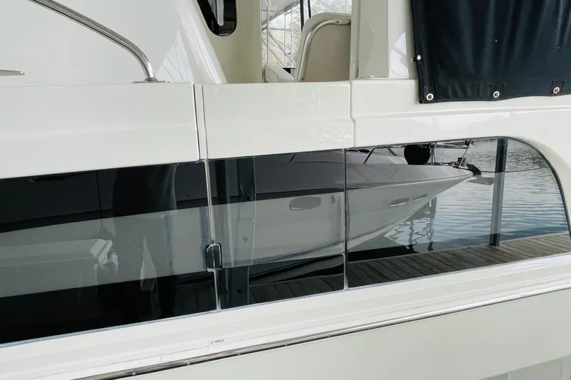 Stay The Course Yacht Photos Pics 2006 Carver 43 Motor Yacht docked, featuring sleek design and reflective windows.