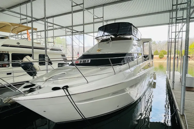 Stay The Course Yacht Photos Pics 2006 Carver 43 Motor Yacht docked in a covered marina.
