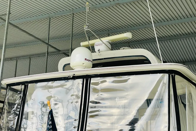 Stay The Course Yacht Photos Pics 2006 Carver 43 Motor Yacht under a metal roof, featuring radar equipment.