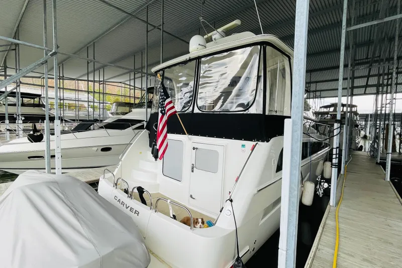 Stay The Course Yacht Photos Pics 2006 Carver 43 Motor Yacht docked in a covered marina, rear view.