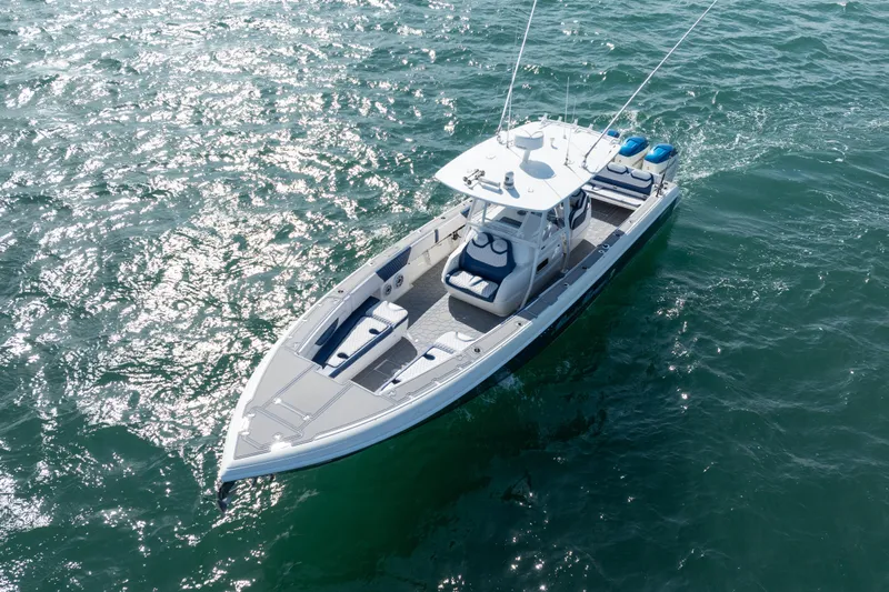 Boss's Therapy Yacht Photos Pics 2007 Intrepid 375 Center Console boat cruising on open water.