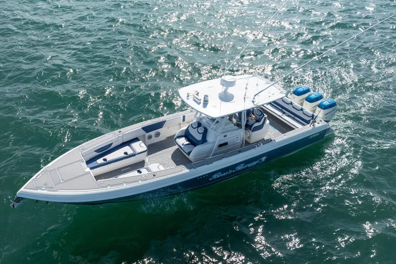 Boss's Therapy Yacht Photos Pics 2007 Intrepid 375 Center Console boat cruising on open water.