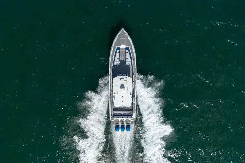 Boss's Therapy Yacht Photos Pics Aerial view of 2007 Intrepid 375 Center Console boat cruising on water.