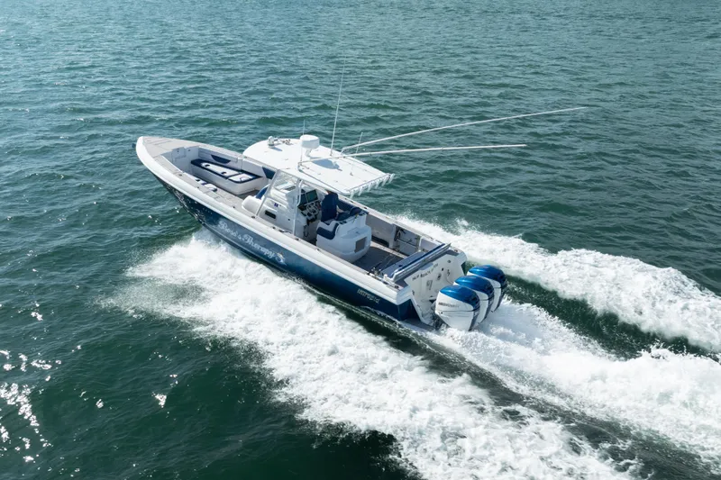 Boss's Therapy Yacht Photos Pics 2007 Intrepid 375 Center Console boat cruising on open water.