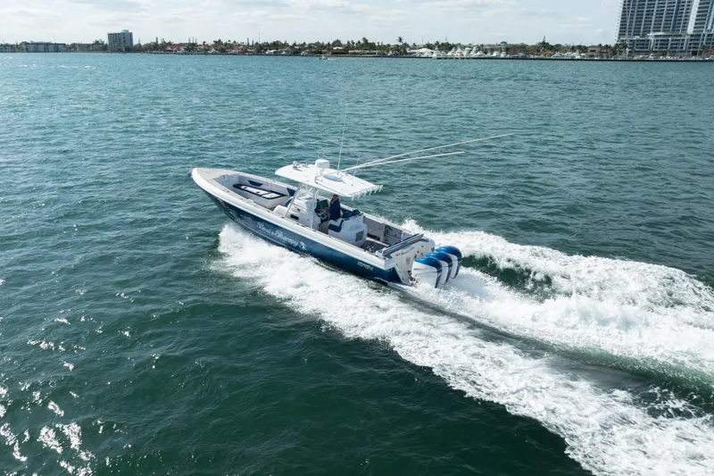 Boss's Therapy Yacht Photos Pics 2007 Intrepid 375 Center Console boat cruising on open water.