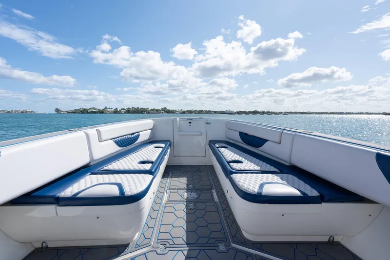Boss's Therapy Yacht Photos Pics 2007 Intrepid 375 Center Console boat interior with cushioned seating, ocean view, and blue sky.