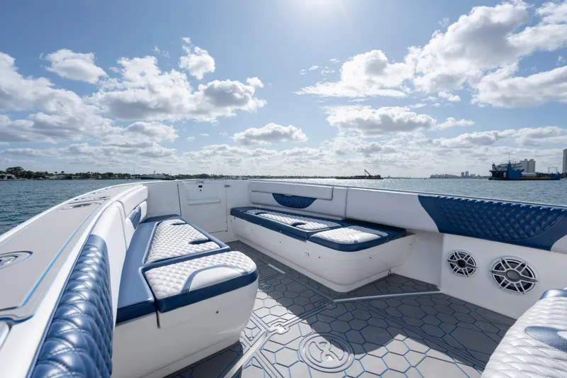 Boss's Therapy Yacht Photos Pics 2007 Intrepid 375 Center Console boat with blue and white seating, on a sunny day.