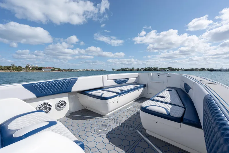 Boss's Therapy Yacht Photos Pics 2007 Intrepid 375 Center Console boat with blue and white seating, on a sunny day.