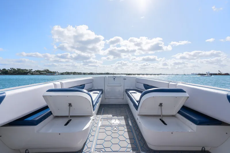 Boss's Therapy Yacht Photos Pics 2007 Intrepid 375 Center Console boat interior with blue seating on a sunny day.