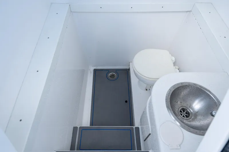 Boss's Therapy Yacht Photos Pics 2007 Intrepid 375 Center Console boat bathroom with toilet and sink.