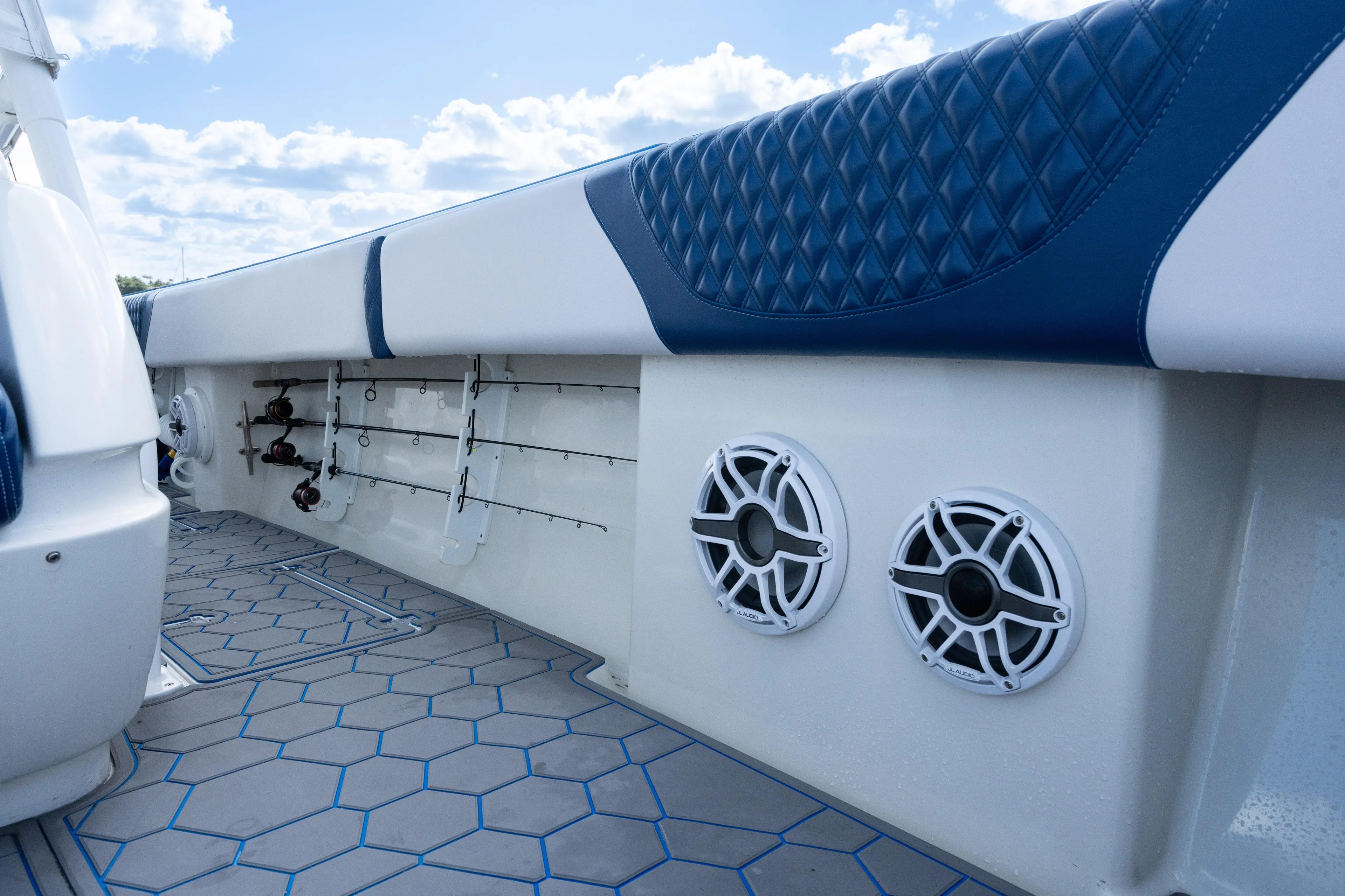 Boss's Therapy Yacht Photos Pics 2007 Intrepid 375 Center Console boat interior with rod holders and speakers.