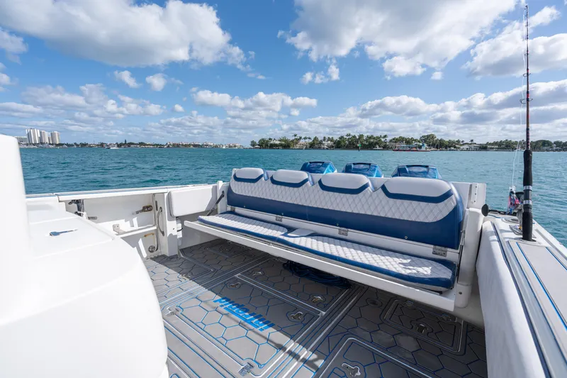 Boss's Therapy Yacht Photos Pics 2007 Intrepid 375 Center Console boat with blue seating, on a sunny day at sea.