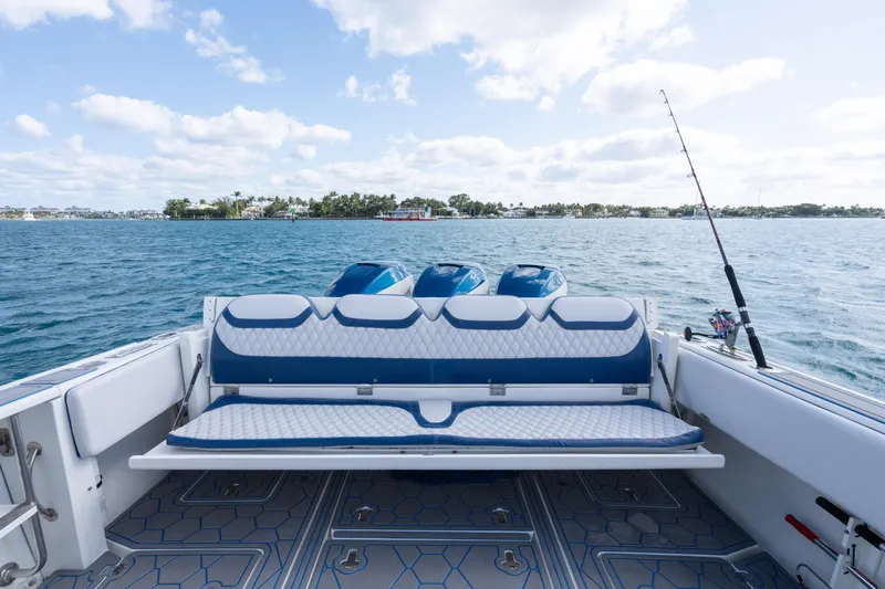 Boss's Therapy Yacht Photos Pics 2007 Intrepid 375 Center Console boat with triple engines on open water.